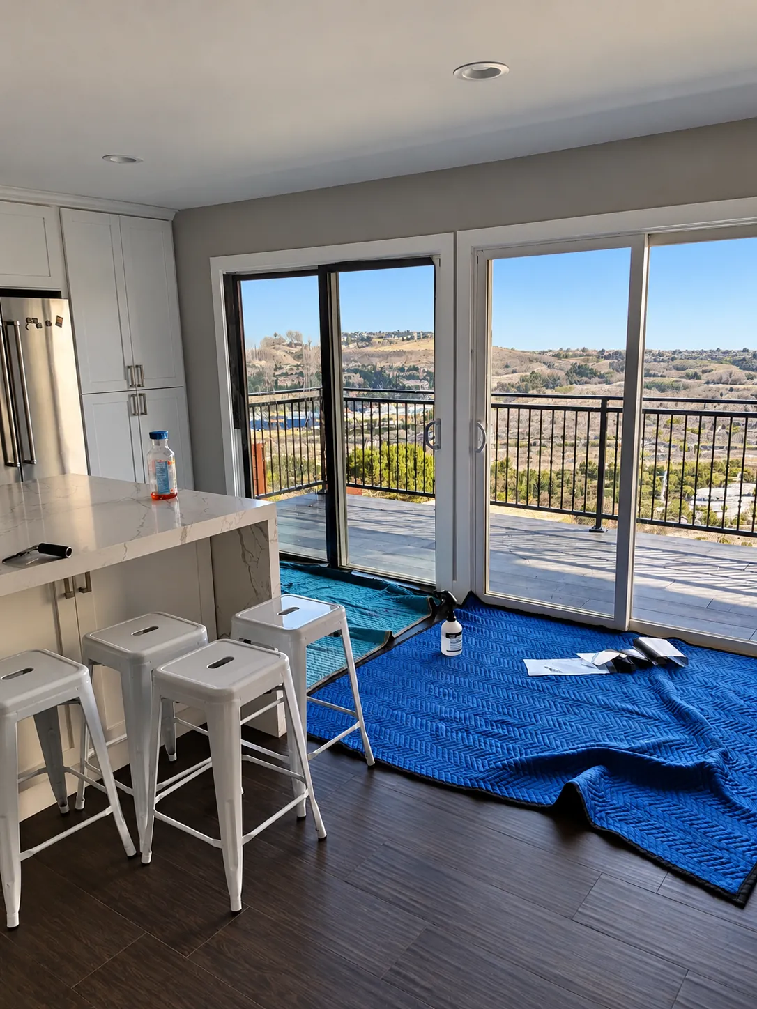 Kitchen sliding doors with window film and a hillside view